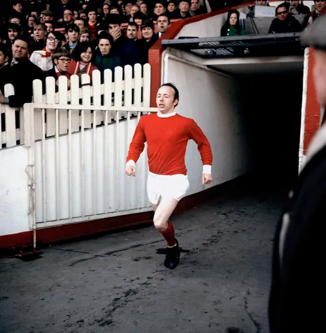 Nobby Stiles pictured emerging from the players' tunnel for Manchester United in 1969