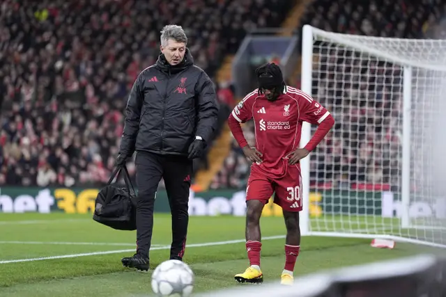 Liverpool’s Jeremie Frimpong looks dejected after going off injured