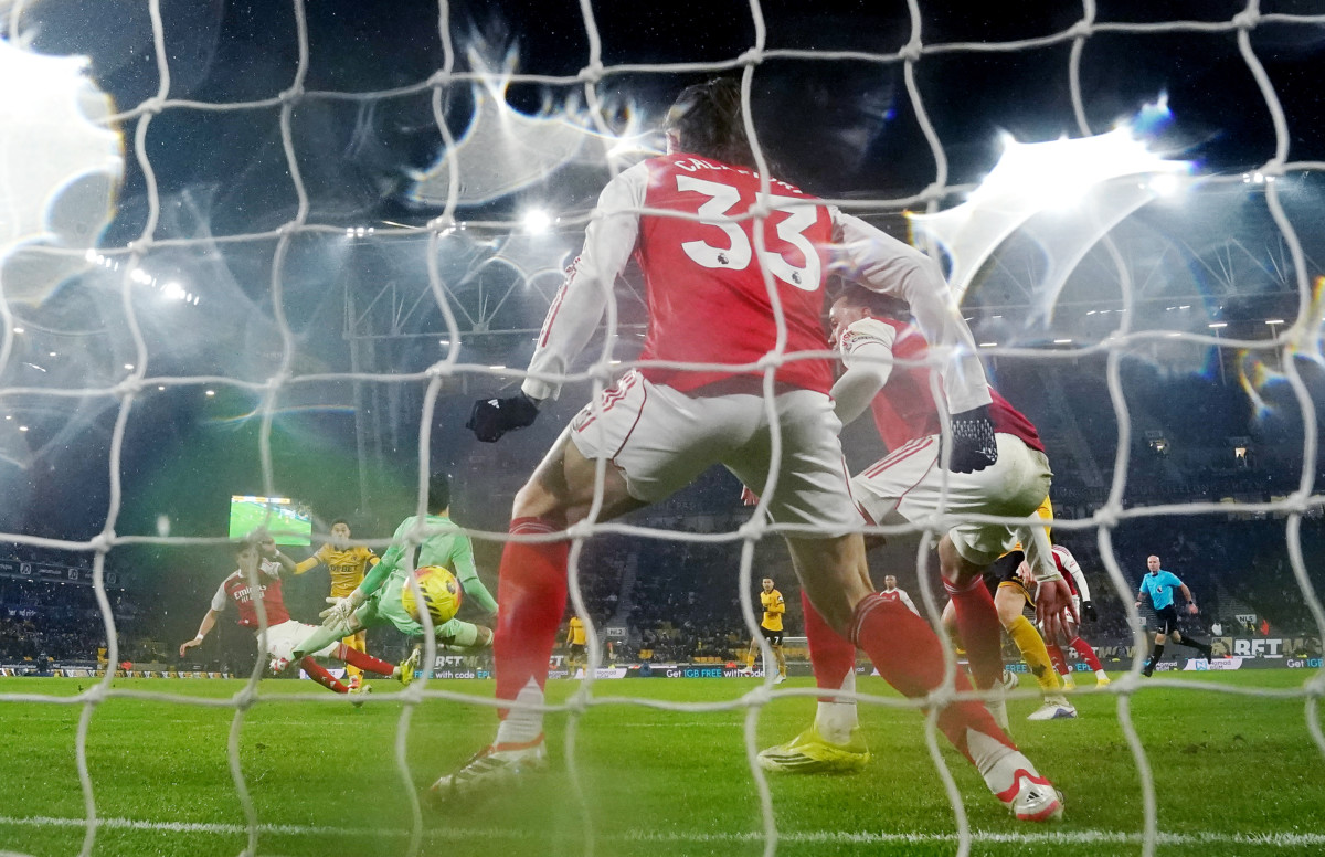 Wolves score as Arsenal players try in vain to stop the ball