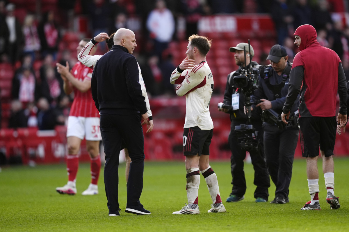 Liverpool’s Alexis Mac Allister, centre, and manager Arne Slot, left, discuss the midfielder's disallowed goal against Nottingham Forest