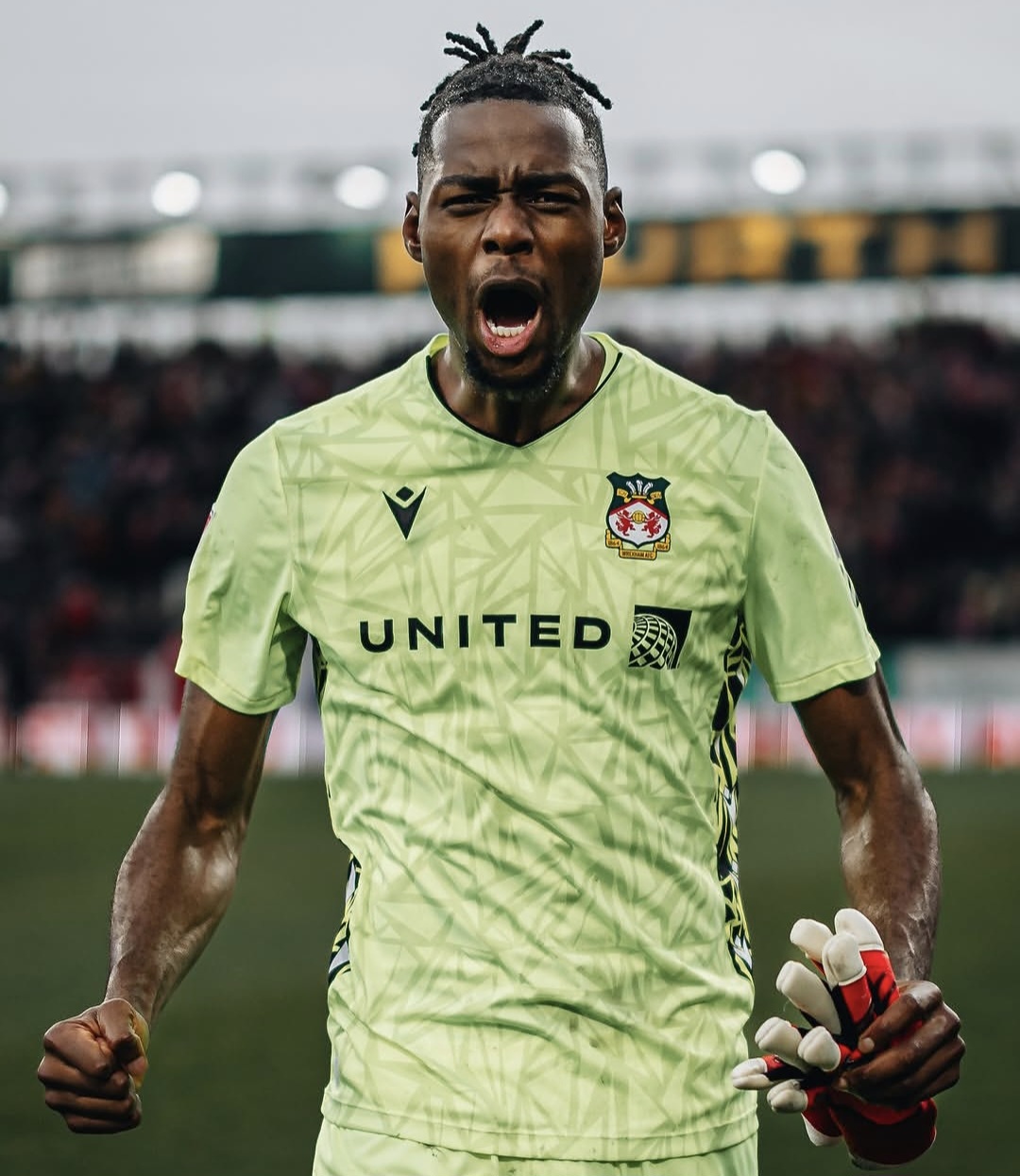 Arthur Okonkwo in action for Wrexham during a league match